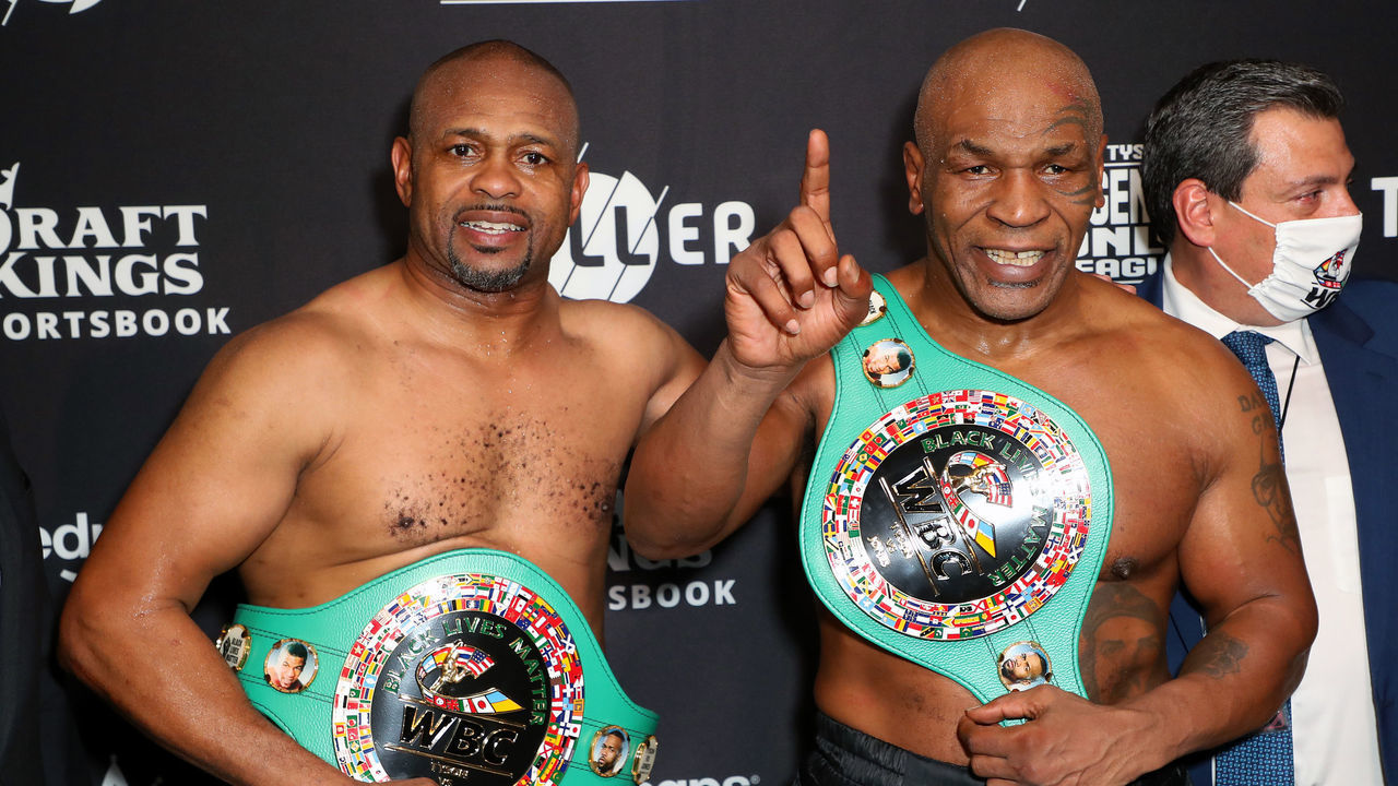 LOS ANGELES, CALIFORNIA - NOVEMBER 28: Roy Jones Jr. (L) and Mike Tyson celebrate their split draw during Mike Tyson vs Roy Jones Jr. presented by Triller at Staples Center on November 28, 2020 in Los Angeles, California.