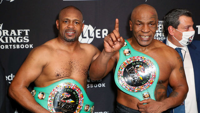 LOS ANGELES, CALIFORNIA - NOVEMBER 28: Roy Jones Jr. (L) and Mike Tyson celebrate their split draw during Mike Tyson vs Roy Jones Jr. presented by Triller at Staples Center on November 28, 2020 in Los Angeles, California.