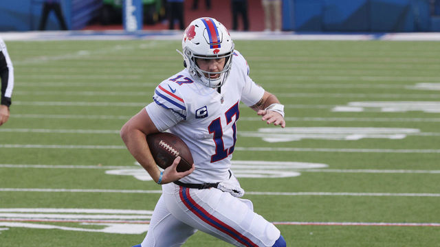 ORCHARD PARK, NEW YORK - NOVEMBER 29: Josh Allen #17 of the Buffalo Bills rolls out against Michael Davis #43 of the Los Angeles Chargers during the third quarter at Bills Stadium on November 29, 2020 in Orchard Park, New York.
