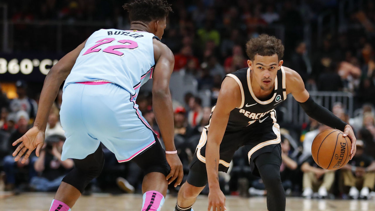 ATLANTA, GA - FEBRUARY 20: Trae Young #11 of the Atlanta Hawks controls the ball as Jimmy Butler #22 of the Miami Heat defendsduring the second half of an NBA game at State Farm Arena on February 20, 2020 in Atlanta, Georgia. NOTE TO USER: User expressly acknowledges and agrees that, by downloading and/or using this photograph, user is consenting to the terms and conditions of the Getty Images License Agreement.