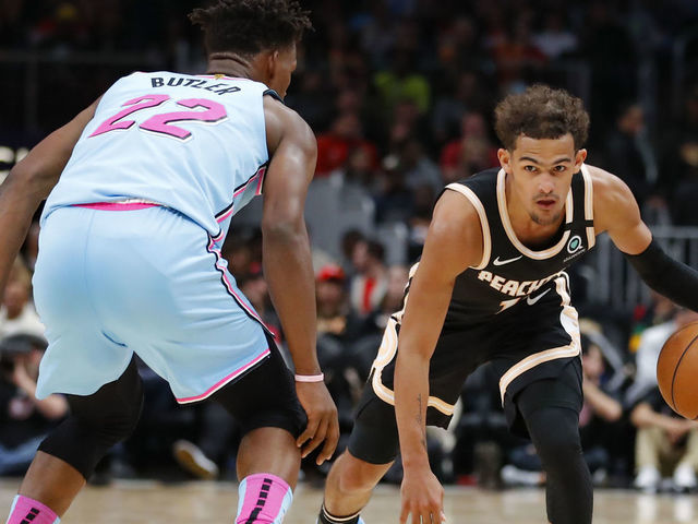 ATLANTA, GA - FEBRUARY 20: Trae Young #11 of the Atlanta Hawks controls the ball as Jimmy Butler #22 of the Miami Heat defendsduring the second half of an NBA game at State Farm Arena on February 20, 2020 in Atlanta, Georgia. NOTE TO USER: User expressly acknowledges and agrees that, by downloading and/or using this photograph, user is consenting to the terms and conditions of the Getty Images License Agreement.