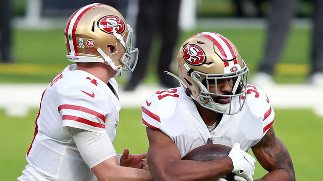 INGLEWOOD, CALIFORNIA - NOVEMBER 29: Nick Mullens #4 of the San Francisco 49ers hands off to Raheem Mostert #31 during the first half against the Los Angeles Rams at SoFi Stadium on November 29, 2020 in Inglewood, California.