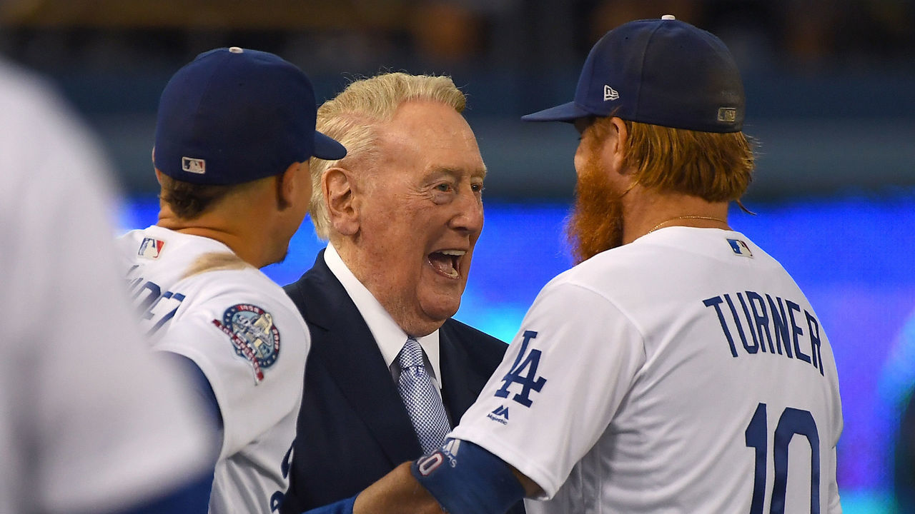 LOS ANGELES, CA - SEPTEMBER 21: Manny Machado #8 and Justin Turner #10 of the Los Angeles Dodgers talks with retired broadcaster Vin Scully who was attending a pregame ceremony honoring language broadcaster Jaime Jarrin at Dodger Stadium on September 2, 2018 in Los Angeles, California.