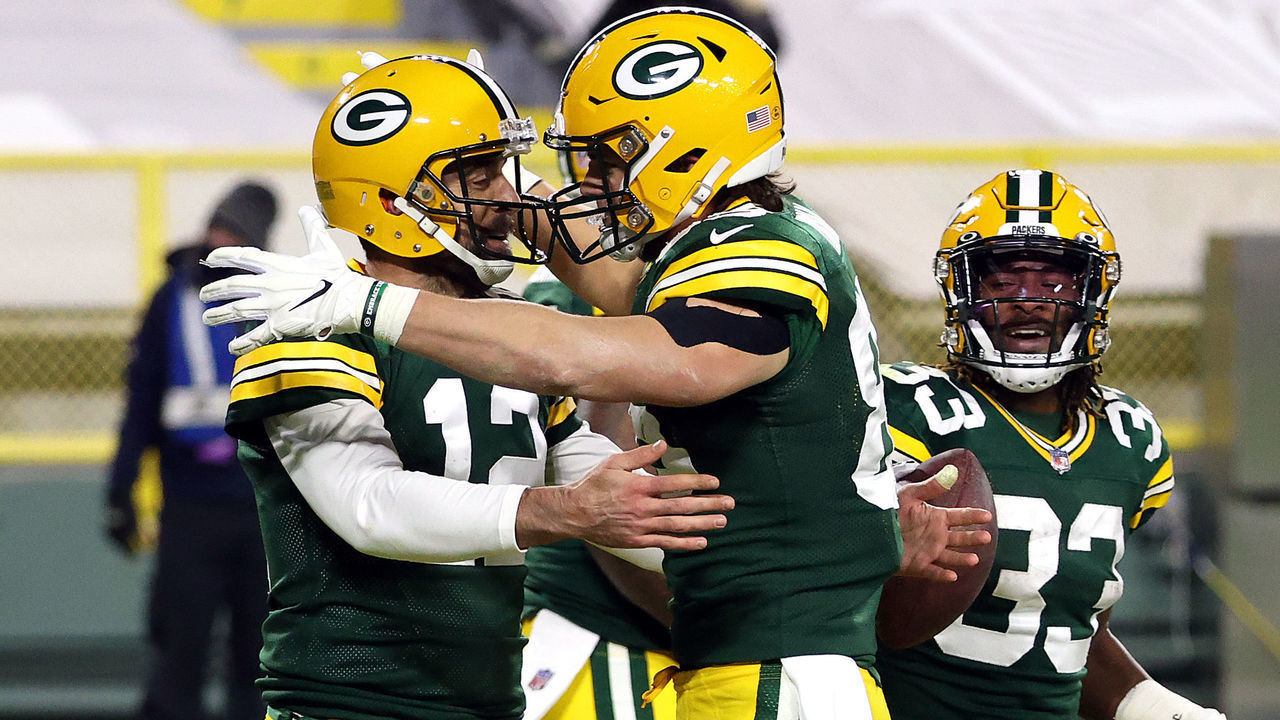 GREEN BAY, WISCONSIN - NOVEMBER 29: Robert Tonyan #85 of the Green Bay Packers hugs quarterback Aaron Rodgers #12 after a touchdown during the 2nd half of the game at Lambeau Field on November 29, 2020 in Green Bay, Wisconsin.