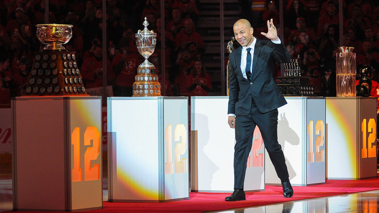CALGARY, AB - MARCH 2: Jarome Iginla waves to the crowd as he walks onto the ice during the night his number twelve jersey will be retired prior to an NHL game against the Minnesota Wild at Scotiabank Saddledome on March 2, 2019 in Calgary, Alberta, Canada.