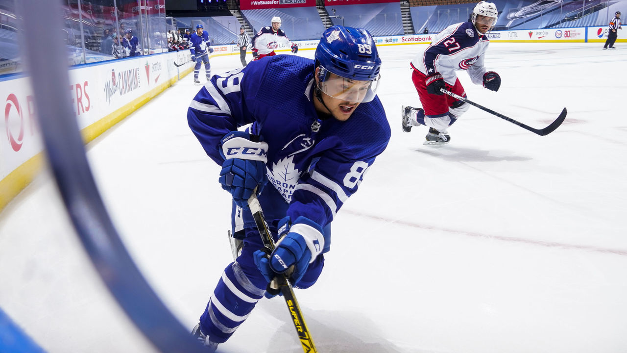 TORONTO, ONTARIO - AUGUST 02: Nick Robertson #89 of the Toronto Maple Leafs plays the puck against the Columbus Blue Jackets during the first period in Game One of the Eastern Conference Qualification Round at Scotiabank Arena on August 02, 2020 in Toronto, Ontario. This is Robertsons first career NHL game.