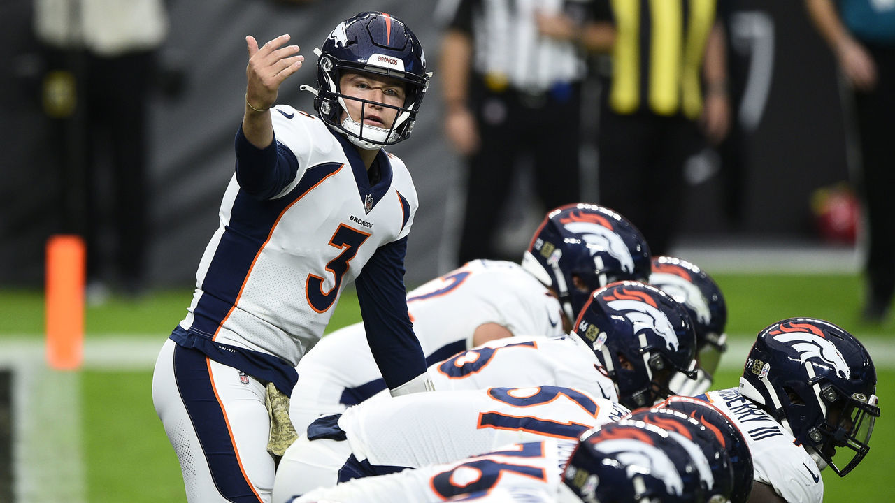 LAS VEGAS, NEVADA - NOVEMBER 15: Quarterback Drew Lock #3 of the Denver Broncos signals at the line of scrimmage against the Las Vegas Raiders in the first half of their game at Allegiant Stadium on November 15, 2020 in Las Vegas, Nevada.
