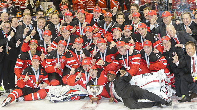 January 05 2015: Team Canada players and coaching staff celebrate with championship trophy following Canada's 5-4 victory over Russia at the IIHF World Junior Championship at Air Canada Centre in Toronto, Canada.