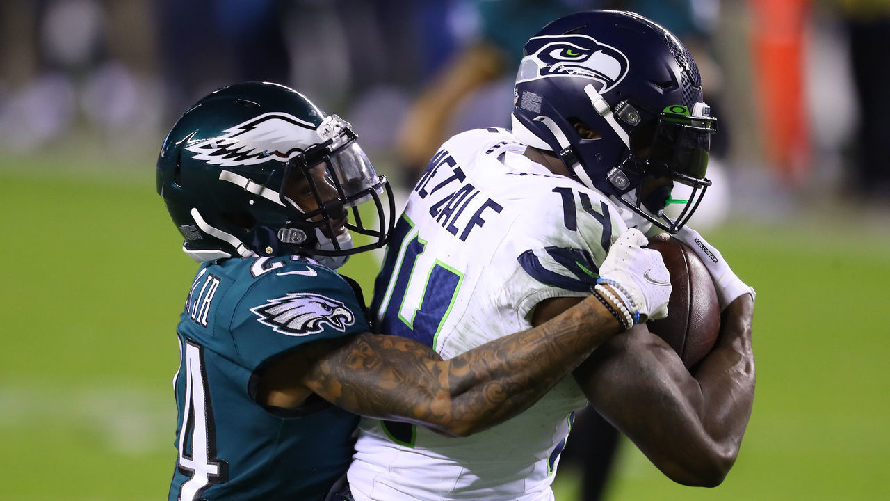 PHILADELPHIA, PENNSYLVANIA - NOVEMBER 30: DK Metcalf #14 of the Seattle Seahawks is tackled by Darius Slay #24 of the Philadelphia Eagles during the second quarter at Lincoln Financial Field on November 30, 2020 in Philadelphia, Pennsylvania.