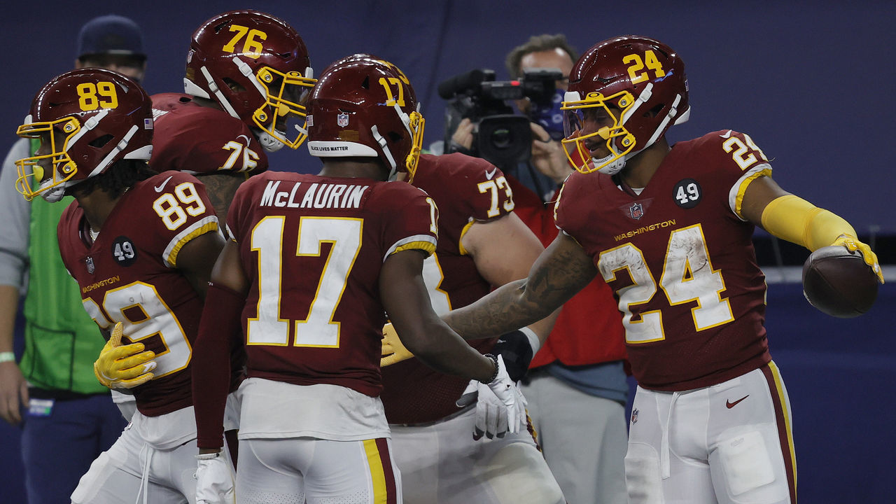 ARLINGTON, TEXAS - NOVEMBER 26: Antonio Gibson #24 of the Washington Football Team celebrates with Terry McLaurin #17, Chase Roullier #73 and Morgan Moses #76 after rushing for a 23-yard touchdown during the fourth quarter of a game against the Dallas Cowboys at AT&T Stadium on November 26, 2020 in Arlington, Texas.