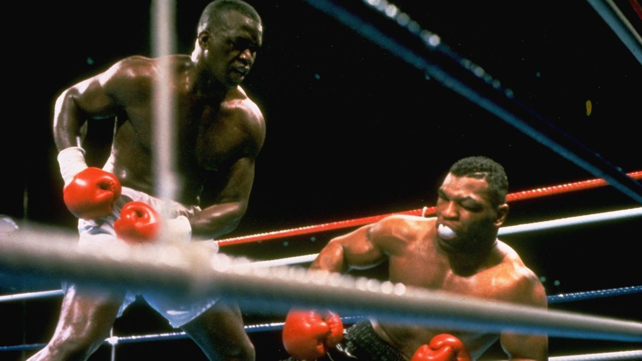 JAPAN - FEBRUARY 11: Boxing: WBC/WBA/IBF Heavyweight Title, James Buster Douglas in action, knocking out Mike Tyson at Tokyo Dome, Tokyo, JPN 2/11/1990