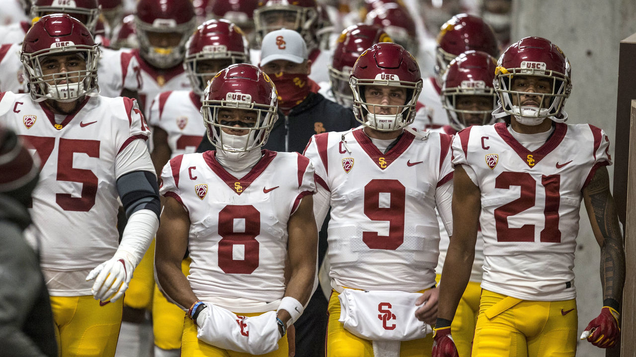 SALT LAKE CITY, UT - NOVEMBER 21: Alijah Vera-Tucker #75, Amon-Ra St. Brown #8, Kedon Slovis #9 and Tyler Vaughns #21 of the USC Trojans lead their team down the tunnel to the field before the start of their game against the Utah Utes November 21, 2020 at Rice Eccles Stadium in Salt Lake City, Utah.