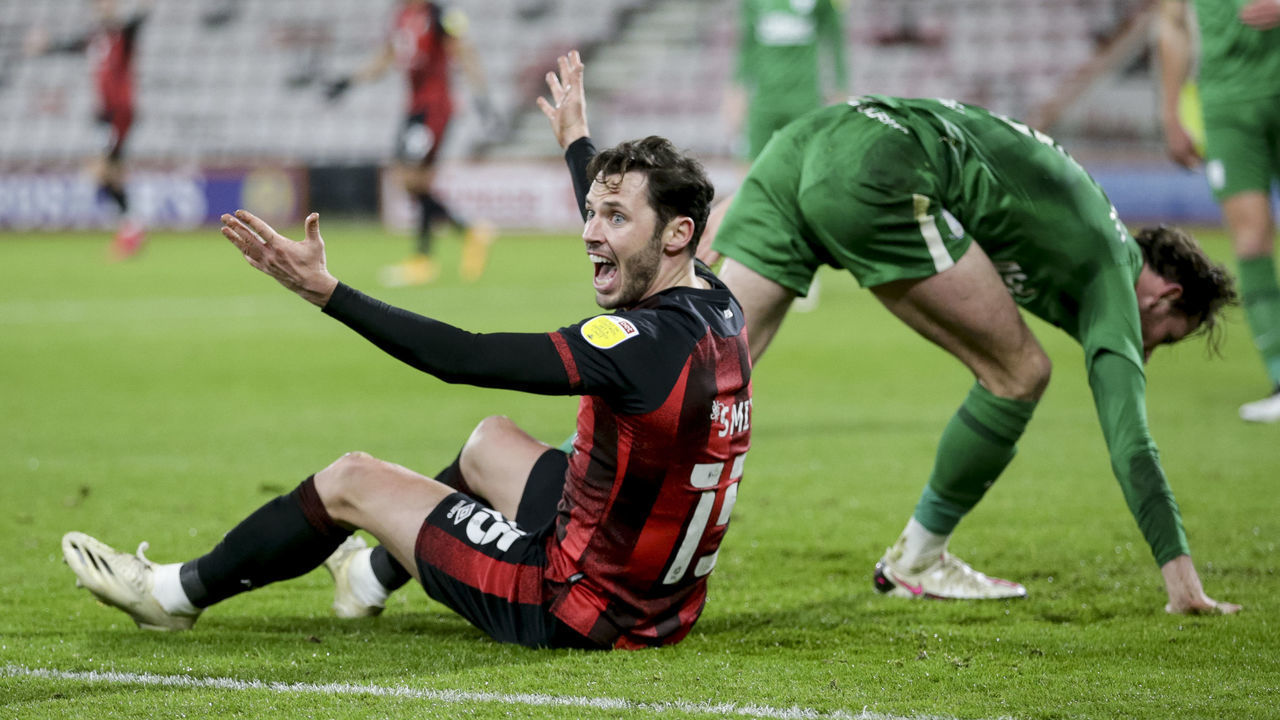 BOURNEMOUTH, ENGLAND - DECEMBER 01: Adam Smith of Bournemouth reacts following a challenge by Alan Browne of Preston North end but his appeal for a penalty is waived away during the Sky Bet Championship match between AFC Bournemouth and Preston North End at Vitality Stadium on December 01, 2020 in Bournemouth, England. Sporting stadiums around the UK remain under strict restrictions due to the Coronavirus Pandemic as Government social distancing laws prohibit fans inside venues resulting in games being played behind closed doors.