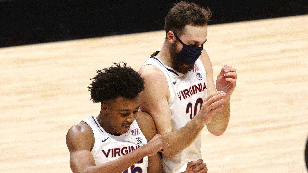 UNCASVILLE, CONNECTICUT - NOVEMBER 25: Trey Murphy III #25 of the Virginia Cavaliers celebrates with Jay Huff #30 during the second half of their game against the Towson Tigers at Mohegan Sun Arena on November 25, 2020 in Uncasville, Connecticut. The Cavaliers defeat the Tigers 89-54.