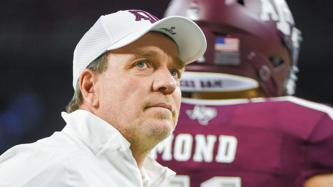 HOUSTON, TX - DECEMBER 27: Texas A&M Aggies head coach Jimbo Fisher watches his team warm up before the football game between the Oklahoma State Cowboys and Texas A&M Aggies at NRG Stadium on December 27, 2019 in Houston, TX.