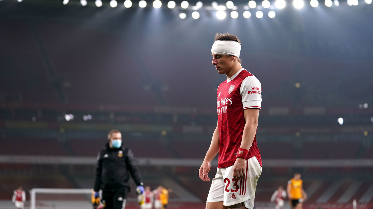 LONDON, ENGLAND - NOVEMBER 29: David Luiz of Arsenal looks on after a collision with Raul Jimenez of Wolverhampton Wanderers (not pictured) during the Premier League match between Arsenal and Wolverhampton Wanderers at Emirates Stadium on November 29, 2020 in London, England. Sporting stadiums around the UK remain under strict restrictions due to the Coronavirus Pandemic as Government social distancing laws prohibit fans inside venues resulting in games being played behind closed doors.