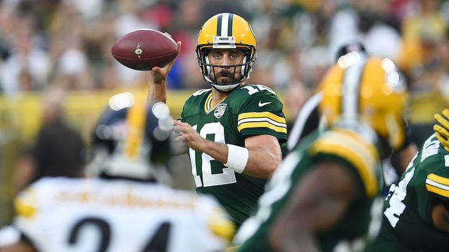 GREEN BAY, WI - AUGUST 16: Aaron Rodgers #12 of the Green Bay Packers drops back to pass during a preseason game against the Pittsburgh Steelers at Lambeau Field on August 16, 2018 in Green Bay, Wisconsin. The Packers defeated the Steelers 51-34.