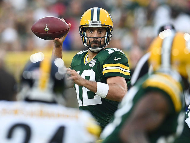 GREEN BAY, WI - AUGUST 16: Aaron Rodgers #12 of the Green Bay Packers drops back to pass during a preseason game against the Pittsburgh Steelers at Lambeau Field on August 16, 2018 in Green Bay, Wisconsin. The Packers defeated the Steelers 51-34.