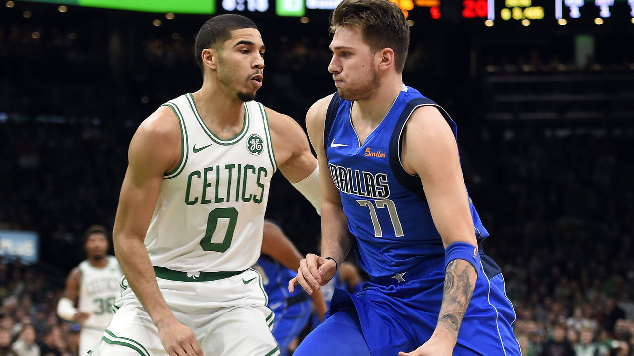 BOSTON, MA - JANUARY 4: Jayson Tatum #0 of the Boston Celtics, left, defends against Luka Doncic #77 of the Dallas Mavericks during the first quarter of an NBA basketball game at TD Garden in Boston, Massachusetts on January 4, 2019.