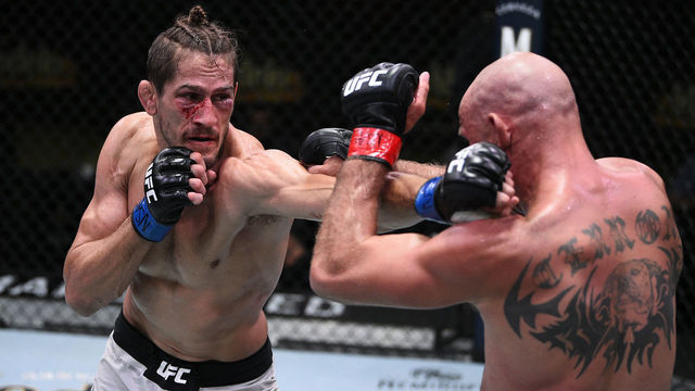 LAS VEGAS, NEVADA - SEPTEMBER 19: (L-R) Niko Price punches Donald Cerrone in their welterweight bout during the UFC Fight Night event at UFC APEX on September 19, 2020 in Las Vegas, Nevada.