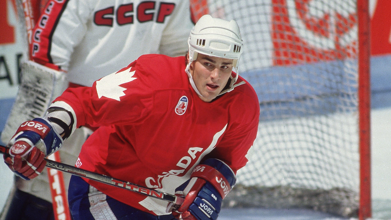 Canadian professional hockey player Eric Lindros (foreground), center for the Oshawa Generals, skates near the goal post as a member of Team Canada during a game with Team USSR at the 1991 Canada Cup, Canada, 1991.