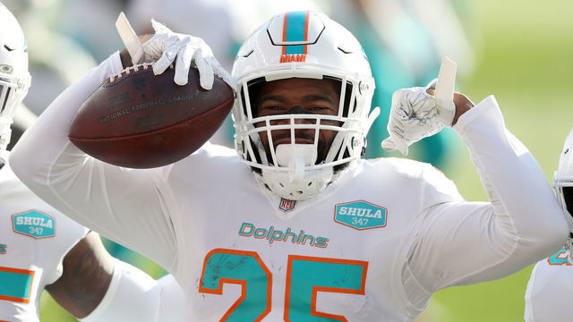 DENVER, COLORADO - NOVEMBER 22: Xavien Howard #25 of the Miami Dolphins celebrates his interception during the first quarter against the Denver Broncos at Empower Field At Mile High on November 22, 2020 in Denver, Colorado.