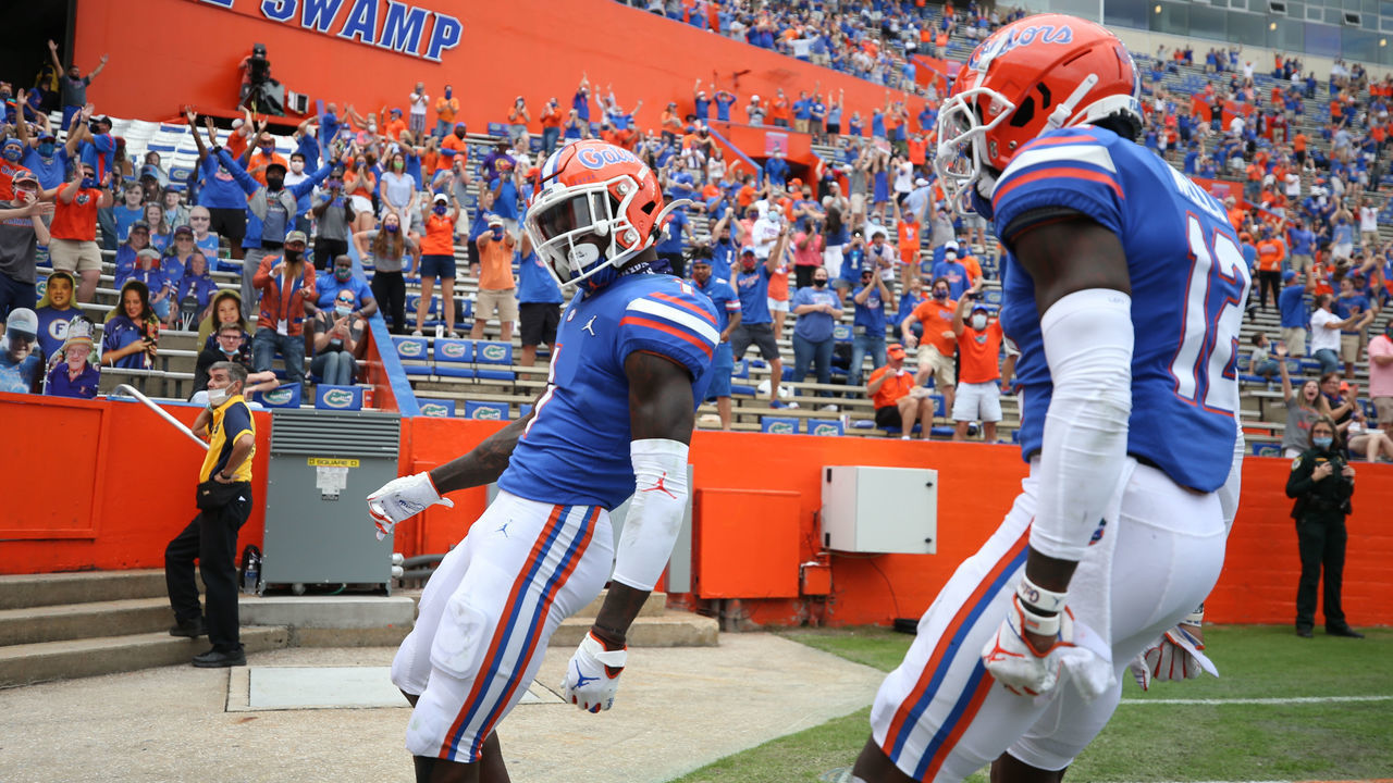 GAINESVILLE, FL - NOVEMBER 28: Kadarius Toney #1 and Rick Wells #12 of the Florida Gators celebrate scoring a touchdown against the Kentucky Wildcats at Ben Hill Griffin Stadium on November 28, 2020 in Gainesville, Florida.