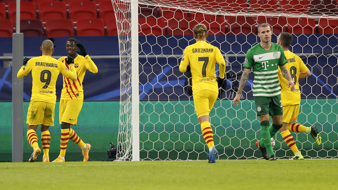 BUDAPEST, HUNGARY - DECEMBER 02: Ousmane Dembele of Barcelona celebrates with team mate Martin Braithwaite (L) after scoring their sides third goal during the UEFA Champions League Group G stage match between Ferencvaros Budapest and FC Barcelona at Psukas Arena on December 02, 2020 in Budapest, Hungary. Sporting stadiums around Hungary remain under strict restrictions due to the Coronavirus Pandemic as Government social distancing laws prohibit fans inside venues resulting in games being played behind closed doors.