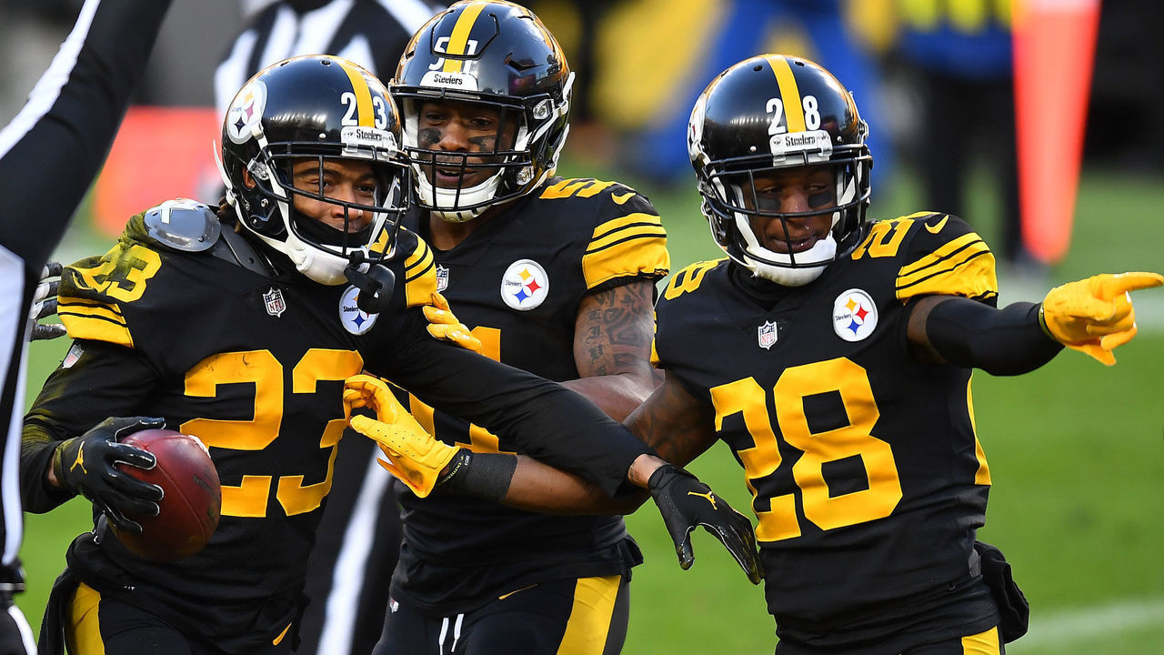 PITTSBURGH, PENNSYLVANIA - DECEMBER 02: From left, Joe Haden #23, Avery Williamson #51 and Mike Hilton #28 of the Pittsburgh Steelers celebrate following a touchdown by Haden during the first quarter against the Baltimore Ravens at Heinz Field on December 02, 2020 in Pittsburgh, Pennsylvania.
