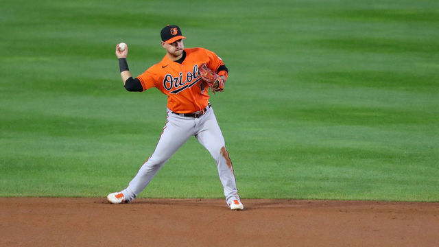 BUFFALO, NY - SEPTEMBER 26: Jose Iglesias #11 of the Baltimore Orioles fields the ball and throws to first base for an out during the second inning at Sahlen Field on September 26, 2020 in Buffalo, New York. The Blue Jays are the home team due to the Canadian government's policy on COVID-19, which prevents them from playing in their home stadium in Canada.