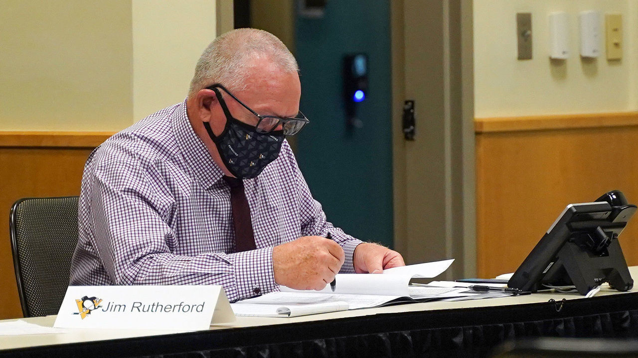 PITTSBURGH, PENNSLYVANIA- OCTOBER 07: General manager Jim Rutherford of the Pittsburgh Penguins sits at the draft table during rounds 2-7 of the 2020 NHL Entry Draft at PPG Paints Arena on October 07, 2020 in Pittsburgh, Pennsylvania. The 2020 NHL Draft was held virtually due to the ongoing Coronavirus pandemic.