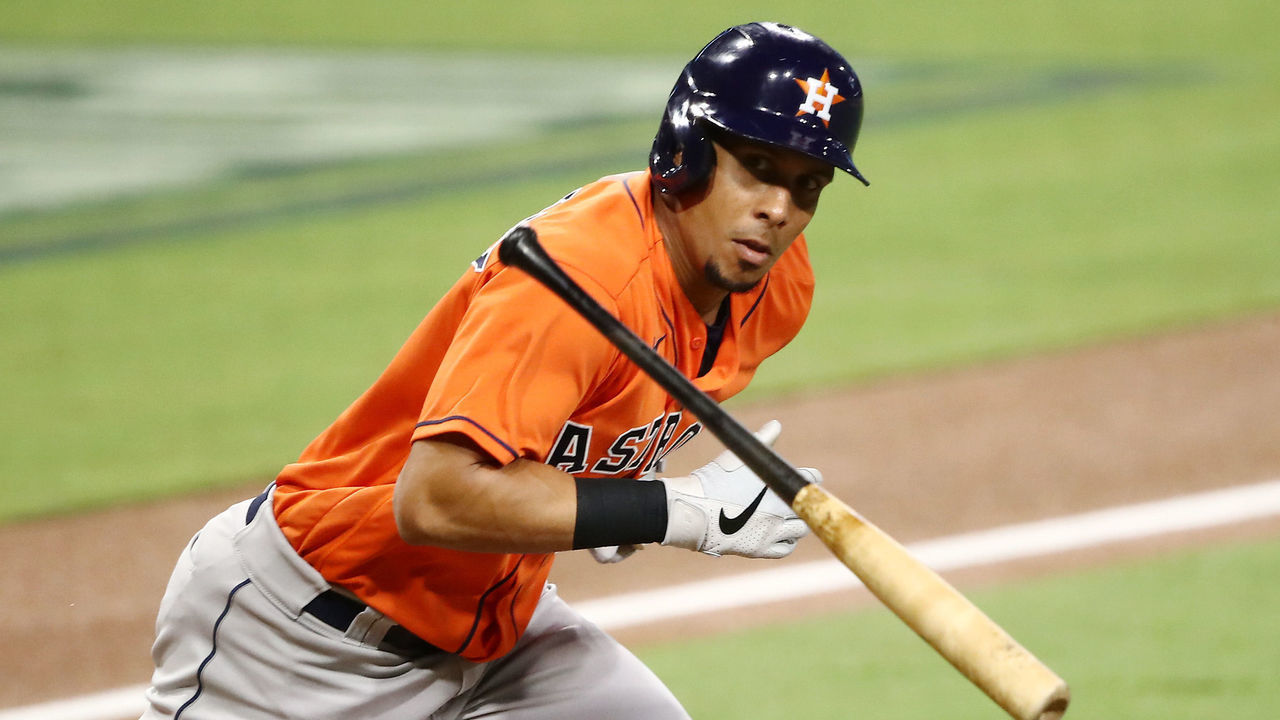 SAN DIEGO, CALIFORNIA - OCTOBER 17: Michael Brantley #23 of the Houston Astros throws his bat while looking at the Tampa Bay Rays dugout while running on a fly out during the third inning in Game Seven of the American League Championship Series at PETCO Park on October 17, 2020 in San Diego, California.