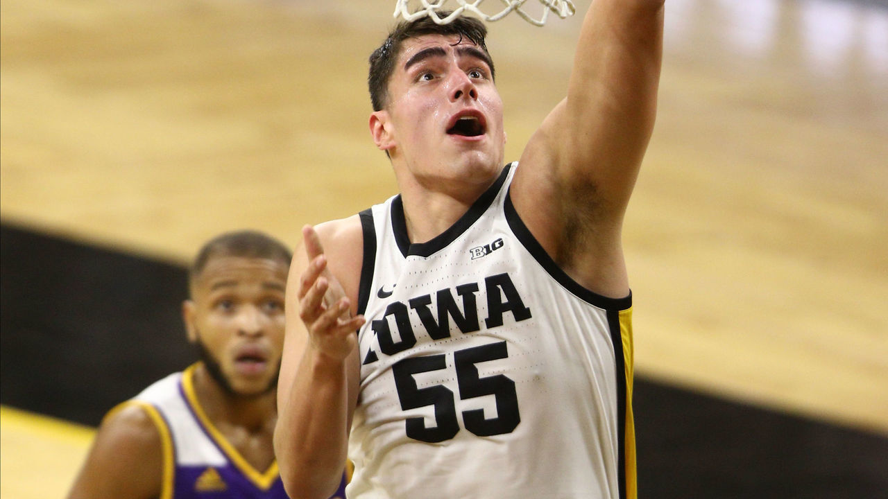 IOWA CITY, IOWA- DECEMBER 03: Forward Luka Garza #55 of the Iowa Hawkeyes goes up for a layup in the first half against guard Justin Brookens #3 of the Western Illinois Leathernecks at Carver-Hawkeye Arena, on December 3, 2020 in Iowa City, Iowa.