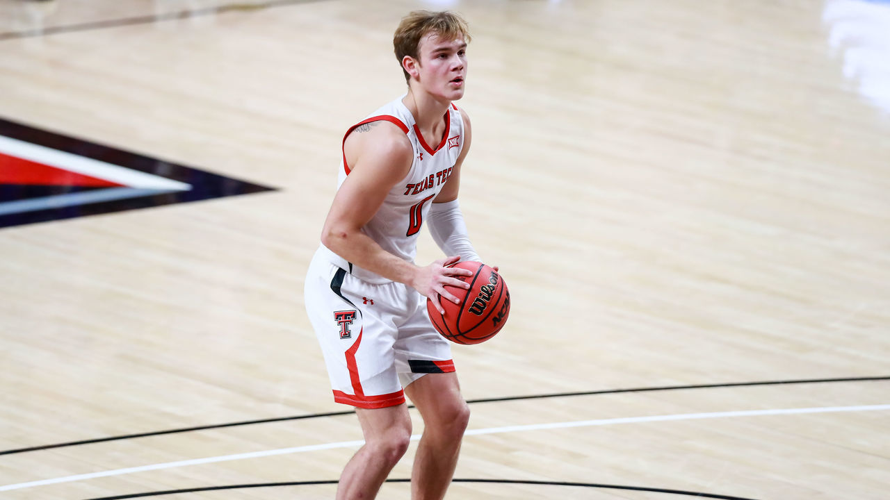 LUBBOCK, TEXAS - NOVEMBER 25: Guard Mac McClung #0 of the Texas Tech Red Raiders shoots a free throw during the first half of the college basketball game against the Northwestern State Demons at United Supermarkets Arena on November 25, 2020 in Lubbock, Texas.