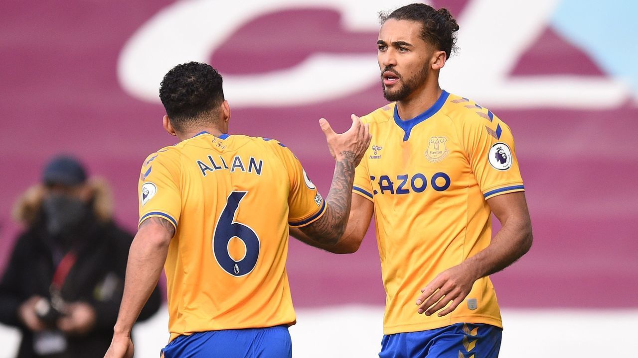 Everton's English striker Dominic Calvert-Lewin (R) celebrates after scoring the equalising goal during the English Premier League football match between Burnley and Everton at Turf Moor in Burnley, north west England on December 5, 2020.