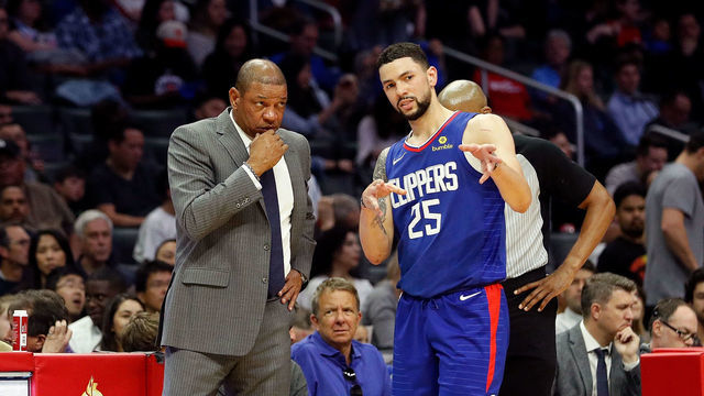 LOS ANGELES, CA - APRIL 07: Austin Rivers #25 of the Los Angeles Clippers speaks to Doc Rivers of the Los Angeles Clippers during the game at Staples Center on April 7, 2018 in Los Angeles, California.