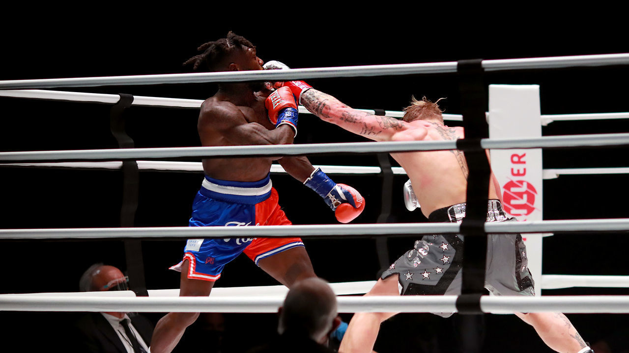 LOS ANGELES, CALIFORNIA - NOVEMBER 28: Jake Paul throws a punch against Nate Robinson in the second round during Mike Tyson vs Roy Jones Jr. presented by Triller at Staples Center on November 28, 2020 in Los Angeles, California.