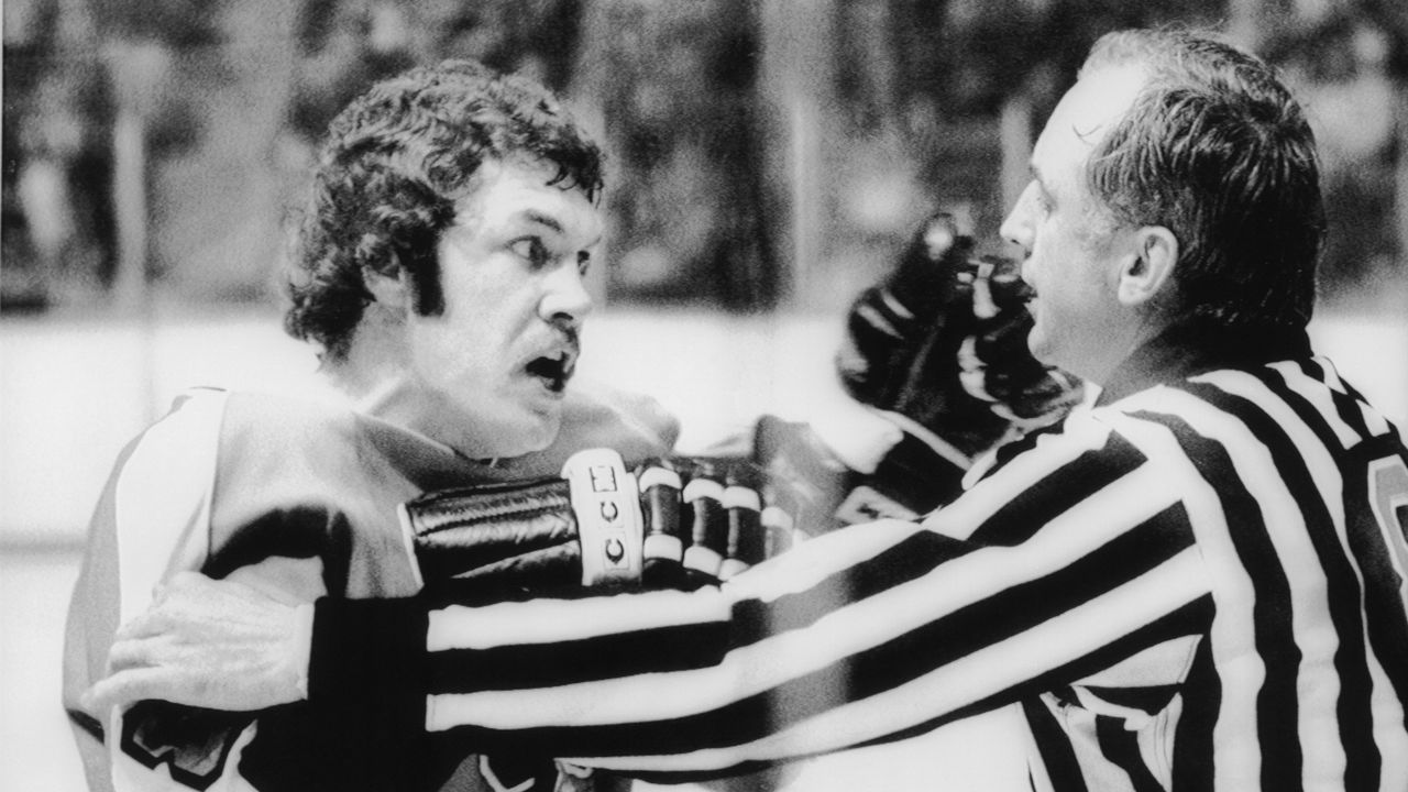 Dave Schultz (L) of the Philadelphia Flyers shows his displeasure with linesman Neil Armstrong (R) after being given a misconduct penalty during a game against the Toronto Maple Leafs.