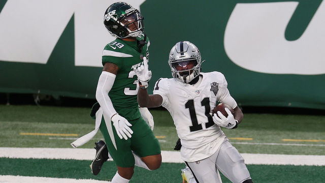 EAST RUTHERFORD, NEW JERSEY - DECEMBER 06: Henry Ruggs III #11 of the Las Vegas Raiders reacts after scoring a touchdown in the final seconds of the second half as Lamar Jackson #38 of the New York Jets looks on at MetLife Stadium on December 06, 2020 in East Rutherford, New Jersey.