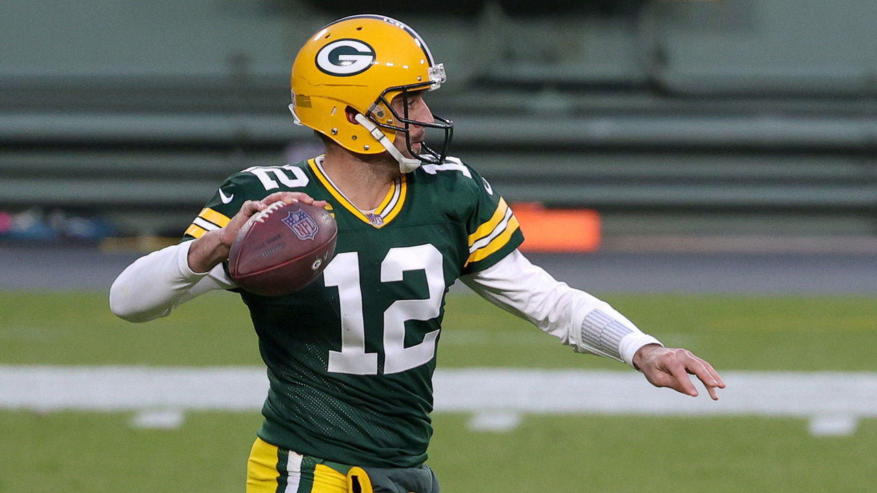 GREEN BAY, WISCONSIN - DECEMBER 06: Aaron Rodgers #12 of the Green Bay Packers looks to pass during the first quarter of their game against the Philadelphia Eagles at Lambeau Field on December 06, 2020 in Green Bay, Wisconsin.