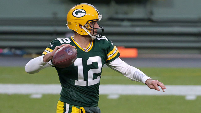 GREEN BAY, WISCONSIN - DECEMBER 06: Aaron Rodgers #12 of the Green Bay Packers looks to pass during the first quarter of their game against the Philadelphia Eagles at Lambeau Field on December 06, 2020 in Green Bay, Wisconsin.