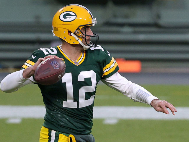GREEN BAY, WISCONSIN - DECEMBER 06: Aaron Rodgers #12 of the Green Bay Packers looks to pass during the first quarter of their game against the Philadelphia Eagles at Lambeau Field on December 06, 2020 in Green Bay, Wisconsin.