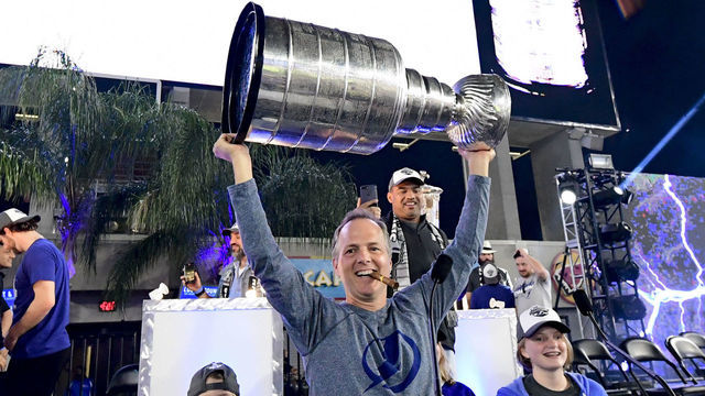 TAMPA, FLORIDA - SEPTEMBER 30: Head coach Jon Cooper of the Tampa Bay Lightning holds the Stanley Cup above his head during the 2020 Stanley Cup Champion rally on September 30, 2020 in Tampa, Florida.