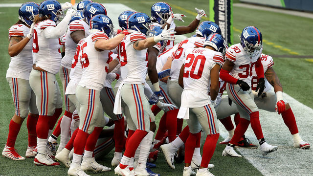 SEATTLE, WASHINGTON - DECEMBER 06: Darnay Holmes #30 of the New York Giants celebrates with his teammates after intercepting a pass thrown by Russell Wilson #3 of the Seattle Seahawks during the fourth quarter in the game at Lumen Field on December 06, 2020 in Seattle, Washington.