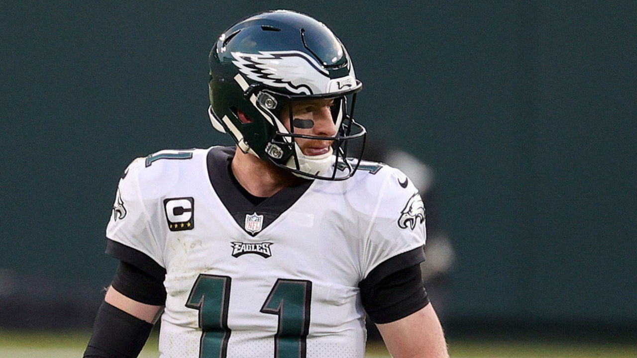 GREEN BAY, WISCONSIN - DECEMBER 06: Carson Wentz #11 of the Philadelphia Eagles looks on following a play in the first quarter of their game against the Green Bay Packers at Lambeau Field on December 06, 2020 in Green Bay, Wisconsin.
