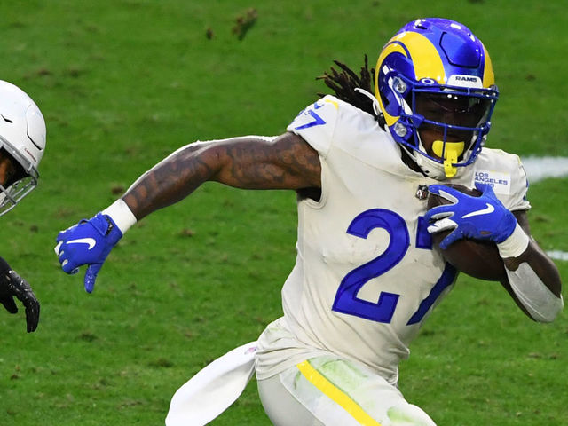 GLENDALE, ARIZONA - DECEMBER 06: Running back Darrell Henderson #27 of the Los Angeles Rams runs the ball for a touchdown as strong safety Budda Baker #32 of the Arizona Cardinals defends during the second half at State Farm Stadium on December 06, 2020 in Glendale, Arizona.