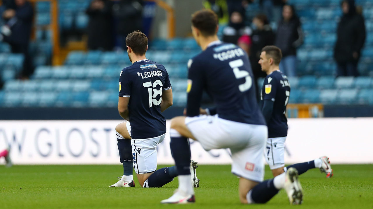 LONDON, ENGLAND - DECEMBER 05: Ryan Leonard of Millwall kneeling for black lives matter during the Sky Bet Championship match between Millwall and Derby County at The Den on December 05, 2020 in London, England. A limited number of fans are welcomed back to stadiums to watch elite football across England. This was following easing of restrictions on spectators in tiers one and two areas only.