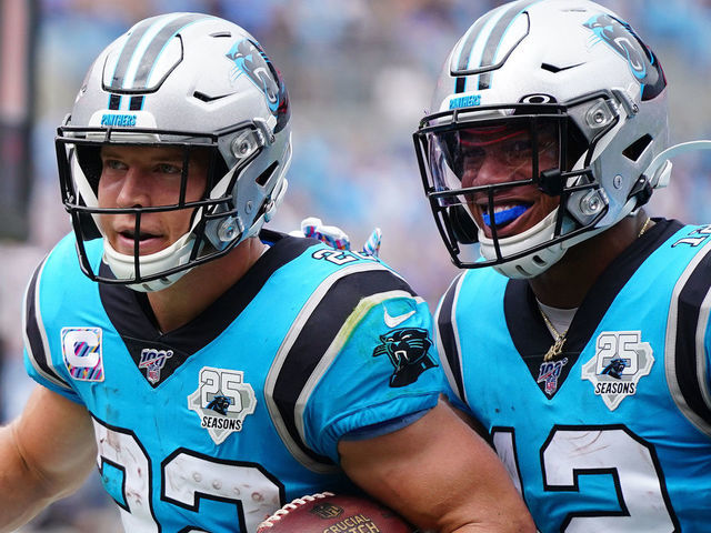 CHARLOTTE, NORTH CAROLINA - OCTOBER 06: Christian McCaffrey #22 of the Carolina Panthers and D.J. Moore #12 of the Carolina Panthers during the first half of their game against the Jacksonville Jaguars at Bank of America Stadium on October 06, 2019 in Charlotte, North Carolina.