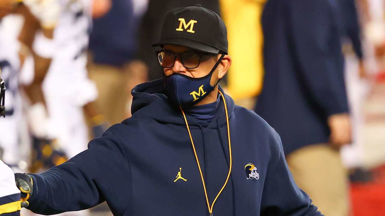 PISCATAWAY, NJ - NOVEMBER 21: Michigan Wolverines head coach Jim Harbaugh talks with Michigan Wolverines defensive back George Johnson (24) during warm up prior to the college football game between the Rutgers Scarlet Knights and the Michigan Wolverines on November 21, 2020 at SHI Stadium in Piscataway, NJ.