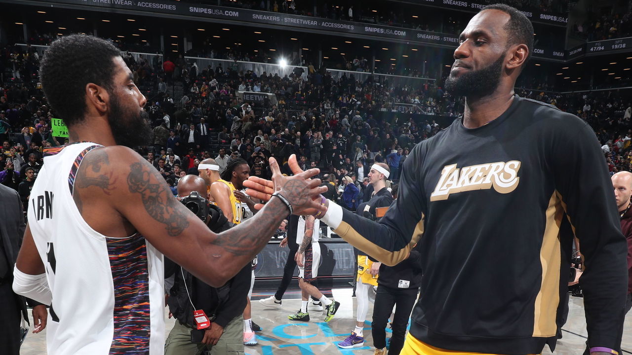 BROOKLYN, NY - JANUARY 23: Kyrie Irving #11 of the Brooklyn Nets and LeBron James #23 of the Los Angeles Lakers hi-five after a game on January 23, 2020 at Barclays Center in Brooklyn, New York. Mandatory Copyright Notice: Copyright 2020 NBAE